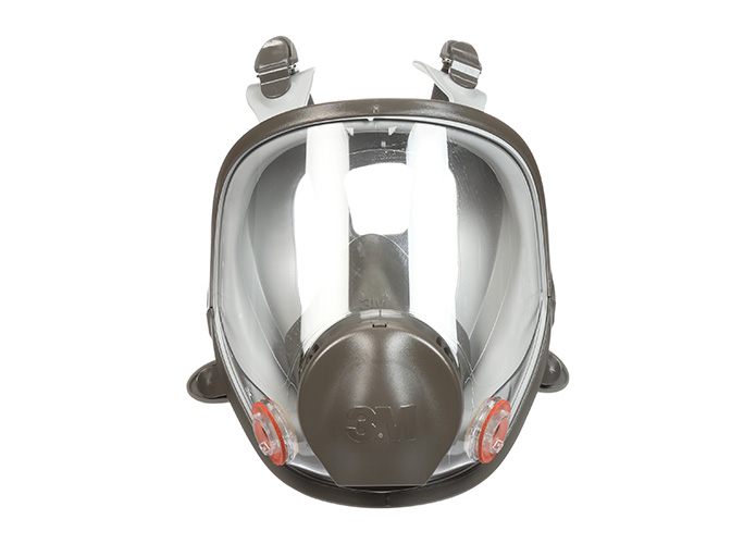 3M full-face respirator mask with clear polycarbonate lens, dual cartridge ports, and adjustable head straps, designed for industrial respiratory protection against airborne contaminants.